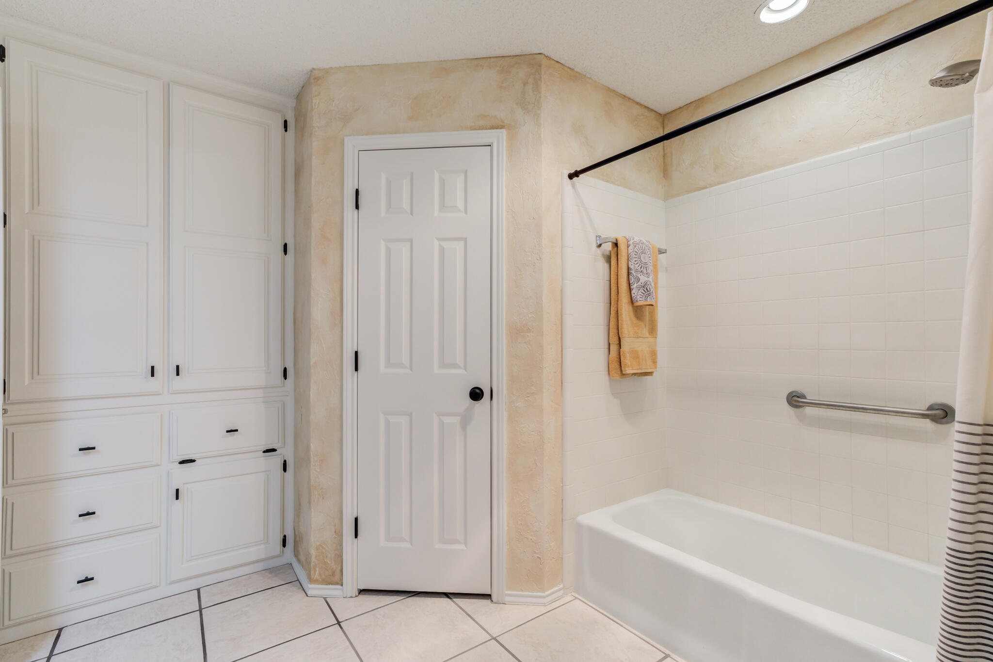 3602 101st Street Lubbock, TX 79423 - Photo 32 of 51 a bathroom with a bathtub and shower