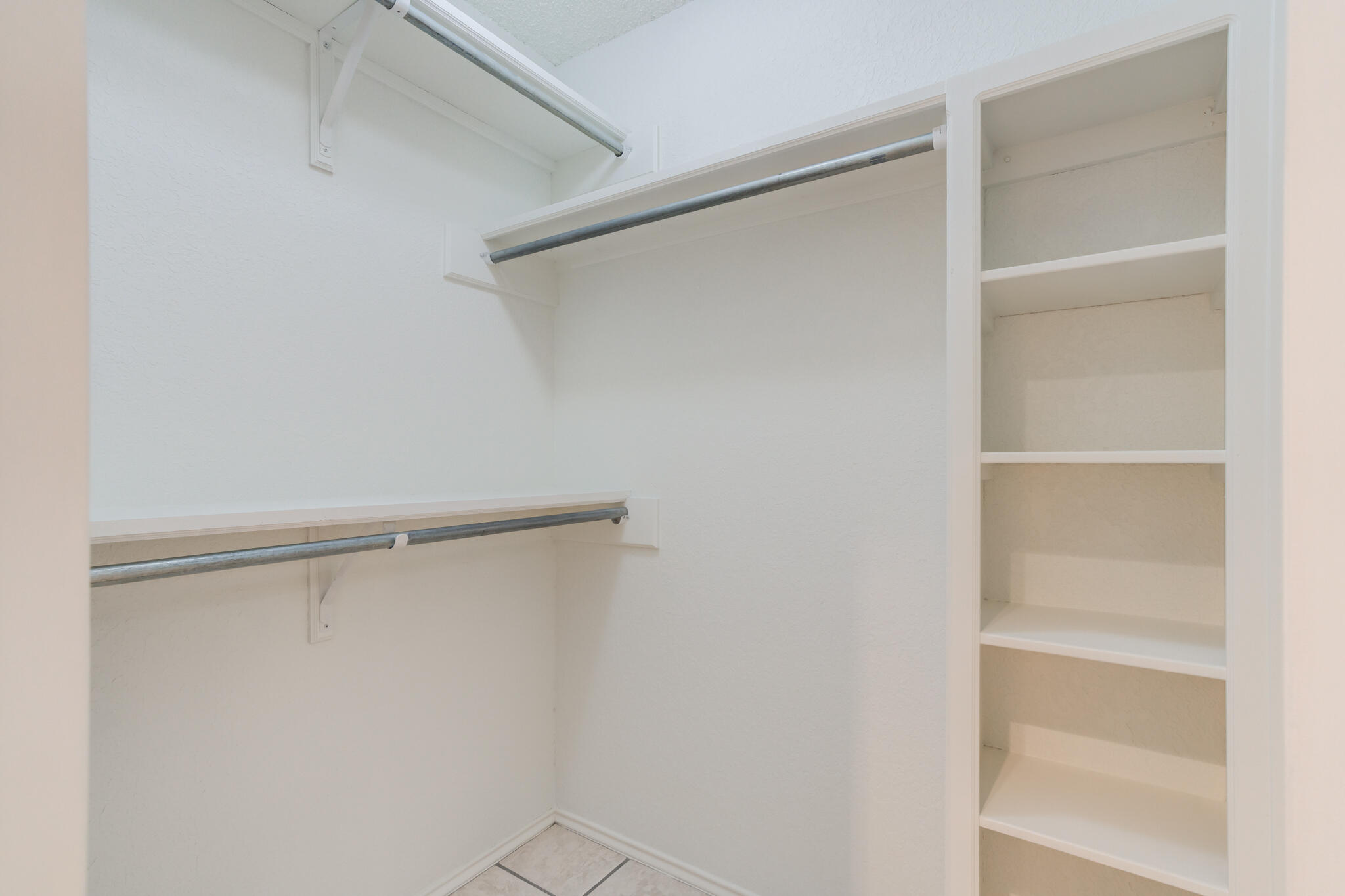 3602 101st Street Lubbock, TX 79423 - Photo 34 of 51 a view of an empty walk in closet