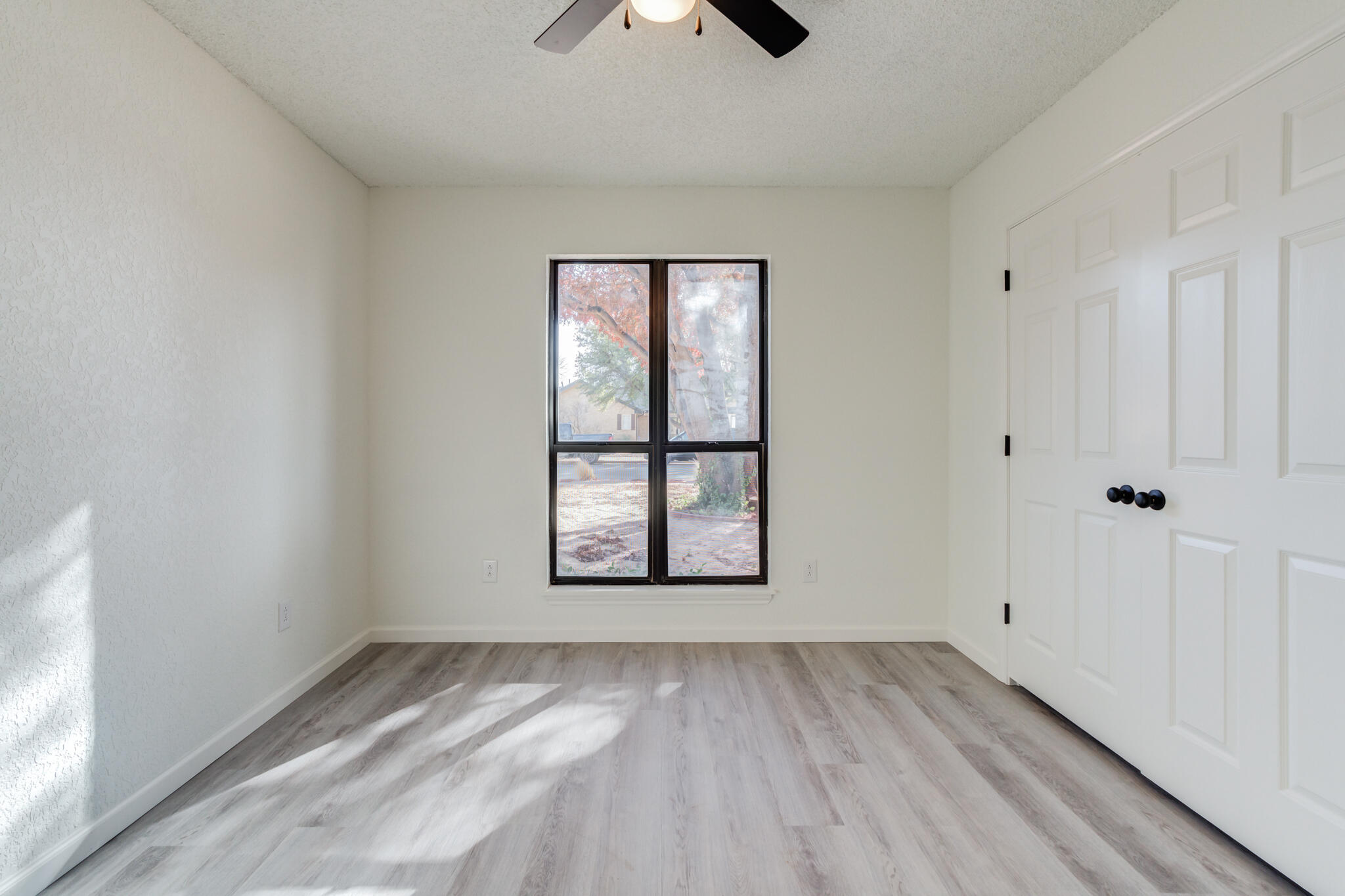 3602 101st Street Lubbock, TX 79423 - Photo 37 of 51 wooden floor in an empty room with a window