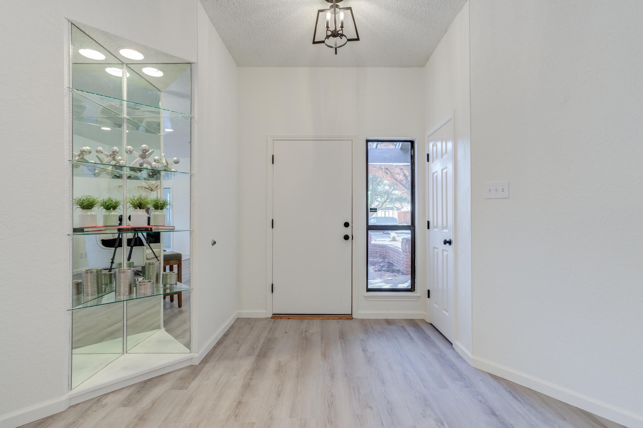 3602 101st Street Lubbock, TX 79423 - Photo 4 of 51 wooden floor in an empty room with a window
