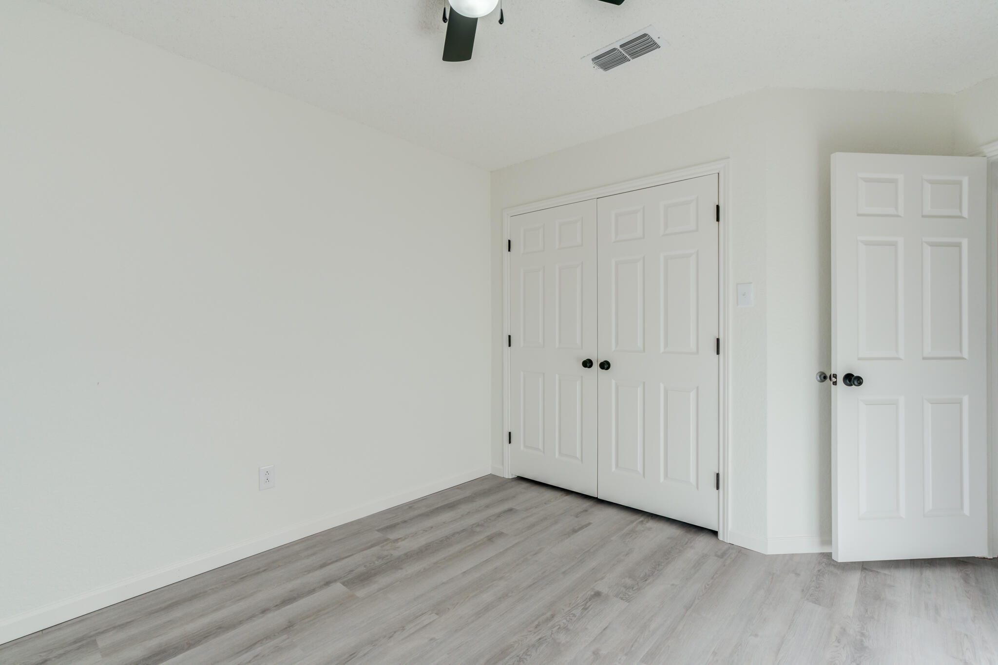 3602 101st Street Lubbock, TX 79423 - Photo 41 of 51 a view of an empty room with wooden floor