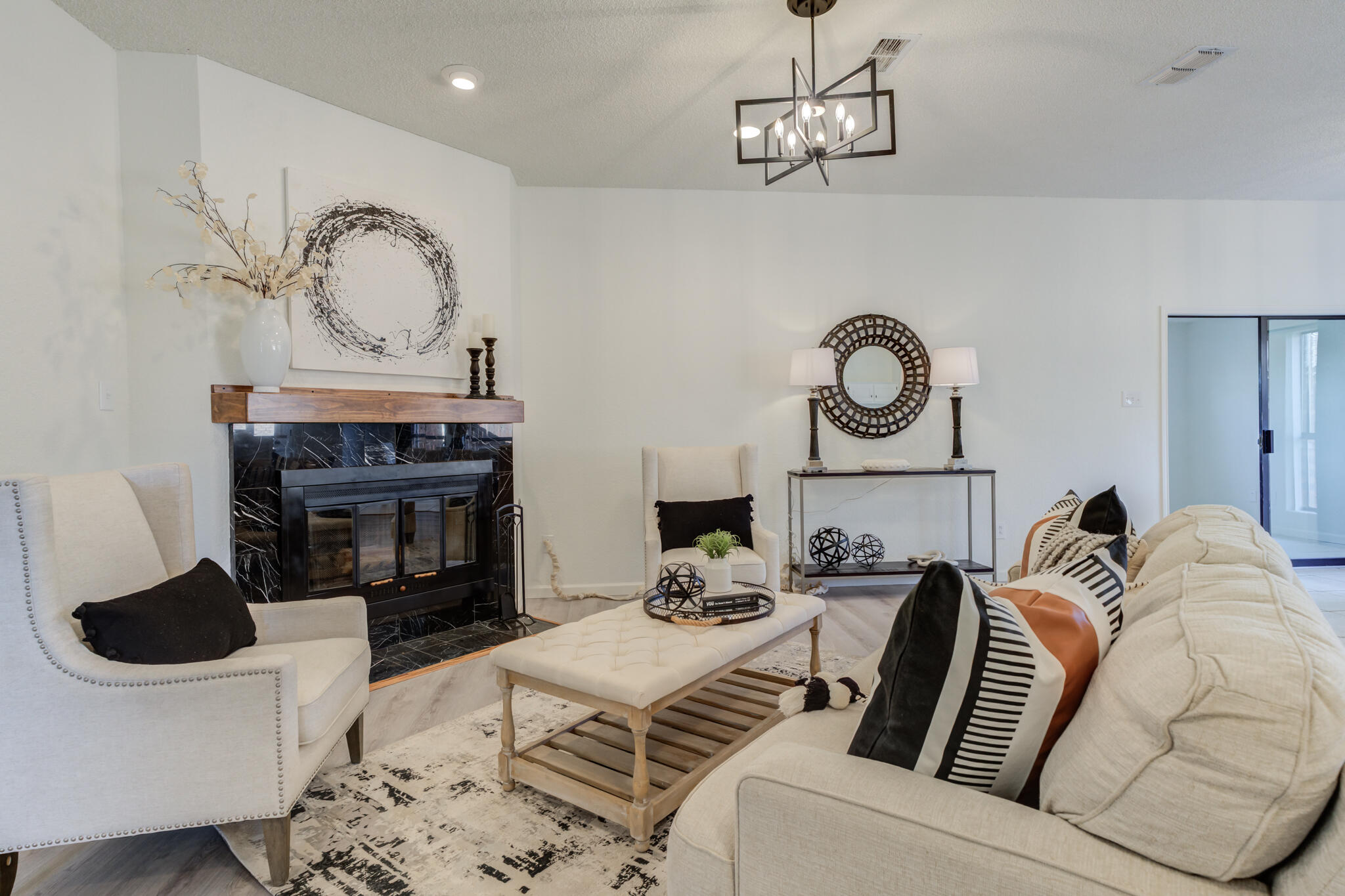 3602 101st Street Lubbock, TX 79423 - Photo 9 of 51 a living room with furniture and a fireplace