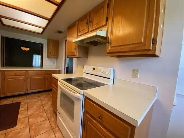 a kitchen with a stove and a microwave