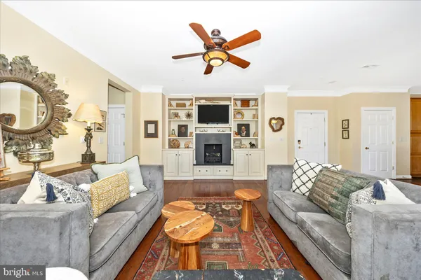 a living room with furniture fireplace and a flat screen tv