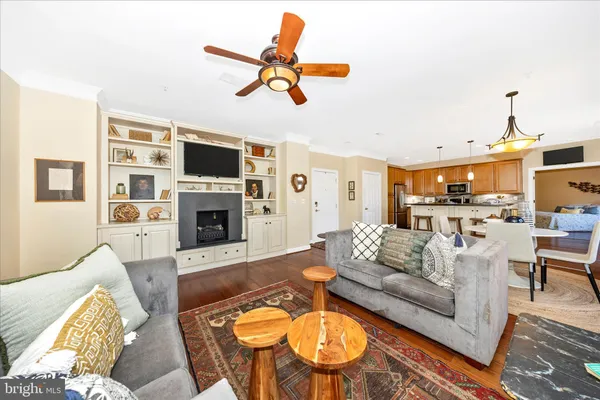 a living room with patio furniture and a large window
