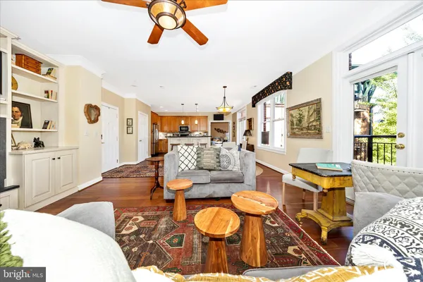 a living room with fireplace furniture and a wooden floor