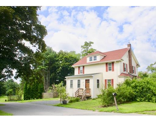 363 Purgatory Road Northbridge, MA 01588 - Photo 3 of 15 a white house with a flower garden in front of it