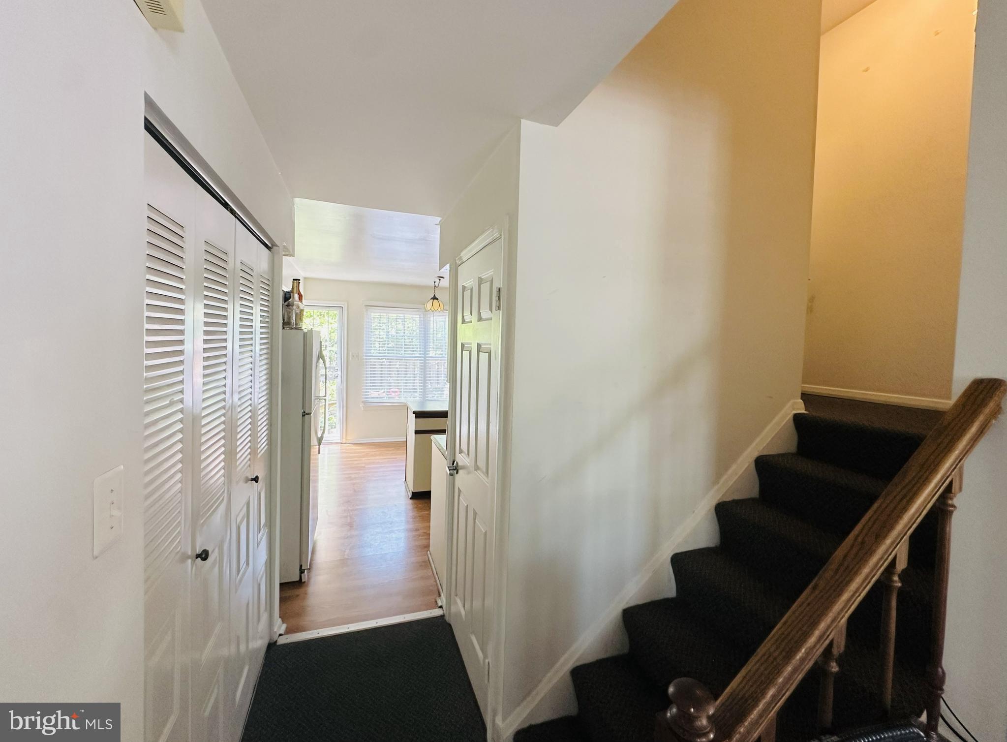 28 North Wolfe Street Baltimore, MD 21231 - Photo 13 of 25 a view of a hallway with wooden floor and staircase