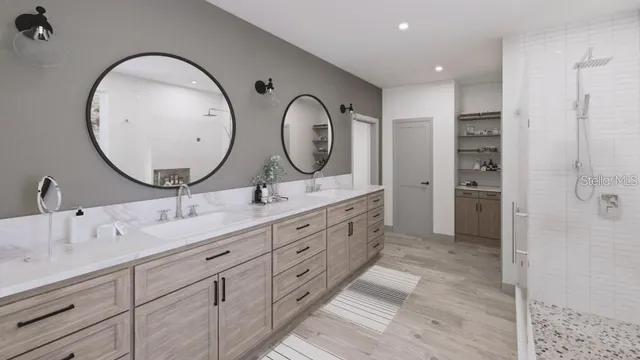 a bathroom with double vanity sink and a mirror