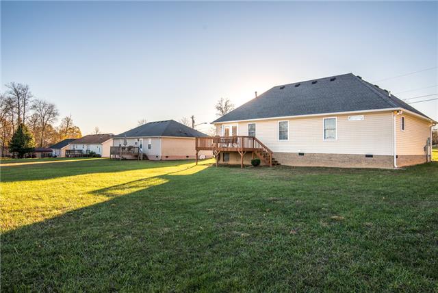 764 Hunters Crossing Lane Springfield, TN 37172 - Photo 17 of 17 Back view of home shows the nice wood deck. Soak up the sunshine while enjoying your favorite beverage.