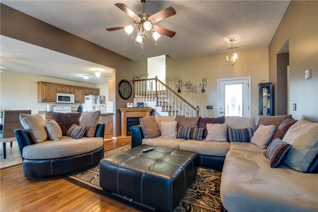 Living room has vaulted ceilings, ceiling fan, corner gas fireplace and wide open to the kitchen. Great for entertaining.