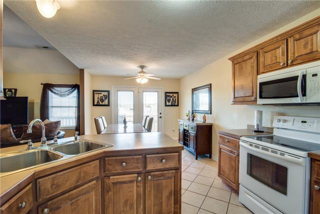 764 Hunters Crossing Lane Springfield, TN 37172 - Photo 8 of 17 This shows you a close up of the nice cabinets and notice the tiled floors.