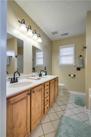 764 Hunters Crossing Lane Springfield, TN 37172 - Photo 10 of 17 Master bathroom has double vanities, separate shower, tiled floors and garden tub.