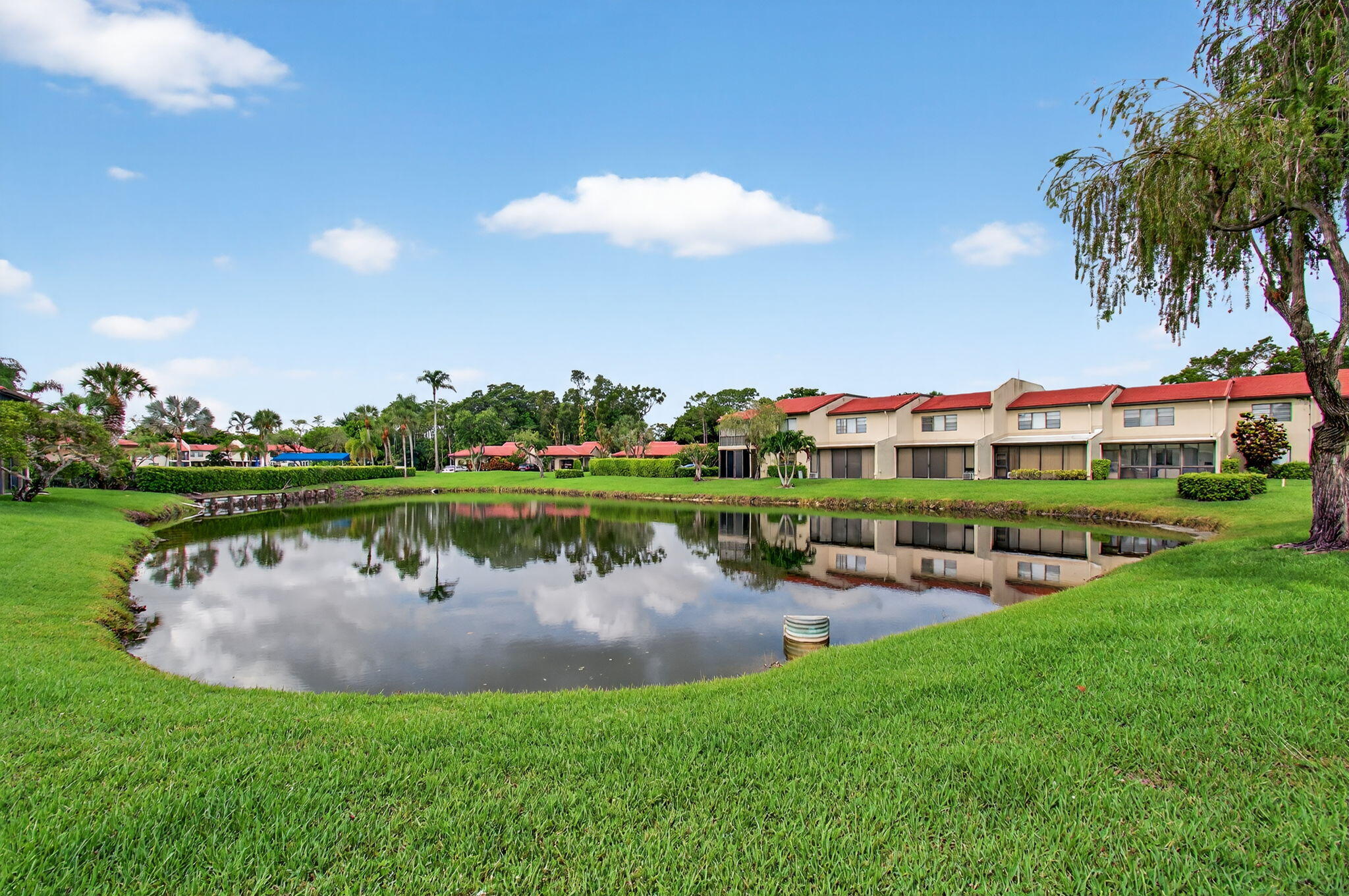 8536 Casa Del Lago, Unit 49B Boca Raton, FL 33433 - Photo 49 of 79 a view of a lake with houses in the back