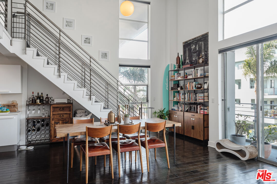 13326 Beach Avenue, Unit 202 Marina del Rey, CA 90292 - Photo 11 of 17 a dining room with furniture and wooden floor