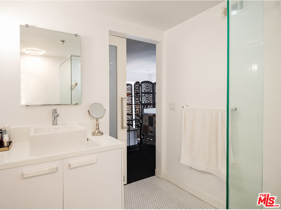 13326 Beach Avenue, Unit 202 Marina del Rey, CA 90292 - Photo 15 of 17 a bathroom with a sink and a mirror