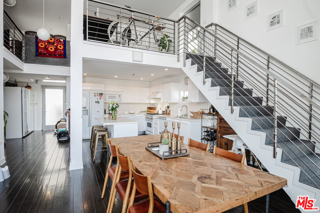 13326 Beach Avenue, Unit 202 Marina del Rey, CA 90292 - Photo 2 of 17 a view of a dining room with furniture and wooden floor