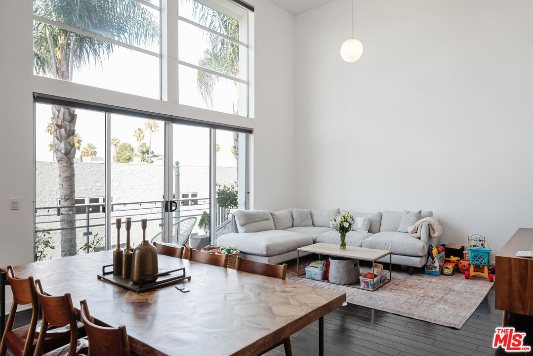 13326 Beach Avenue, Unit 202 Marina del Rey, CA 90292 - Photo 6 of 17 a living room with furniture and floor to ceiling windows