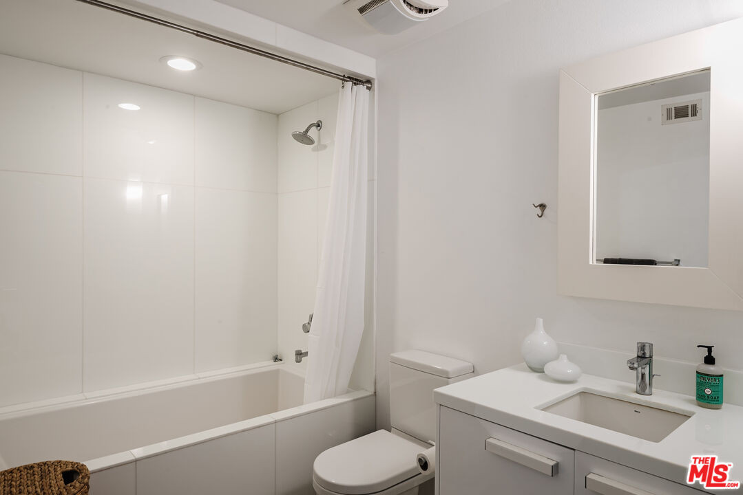 13326 Beach Avenue, Unit 202 Marina del Rey, CA 90292 - Photo 9 of 17 a bathroom with a sink toilet and shower