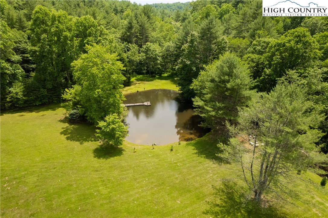 624 Wildcat Ridge Road Deep Gap, NC 28618 - Photo 7 of 50 a view of a lake with houses