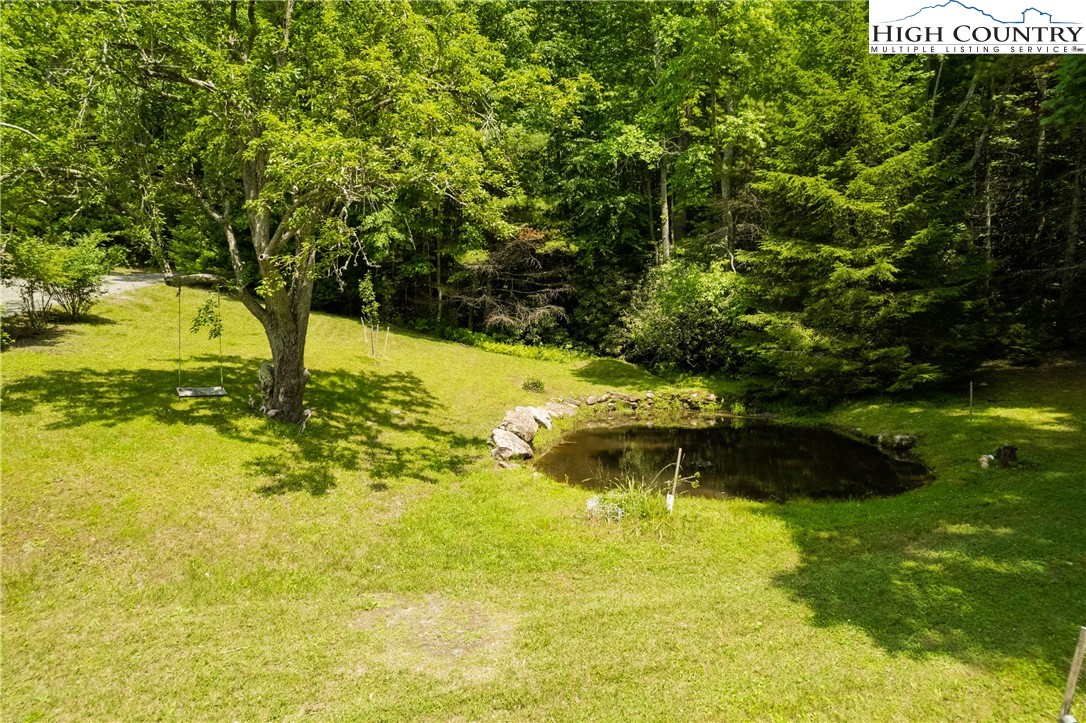 624 Wildcat Ridge Road Deep Gap, NC 28618 - Photo 9 of 50 a garden view with a lake view