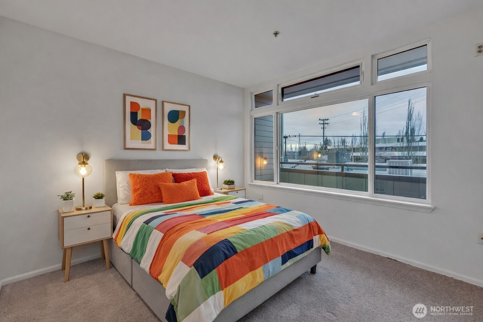 18 Dravus Street, Unit 207 Seattle, WA 98109 - Photo 16 of 34 a bedroom with a bed and window