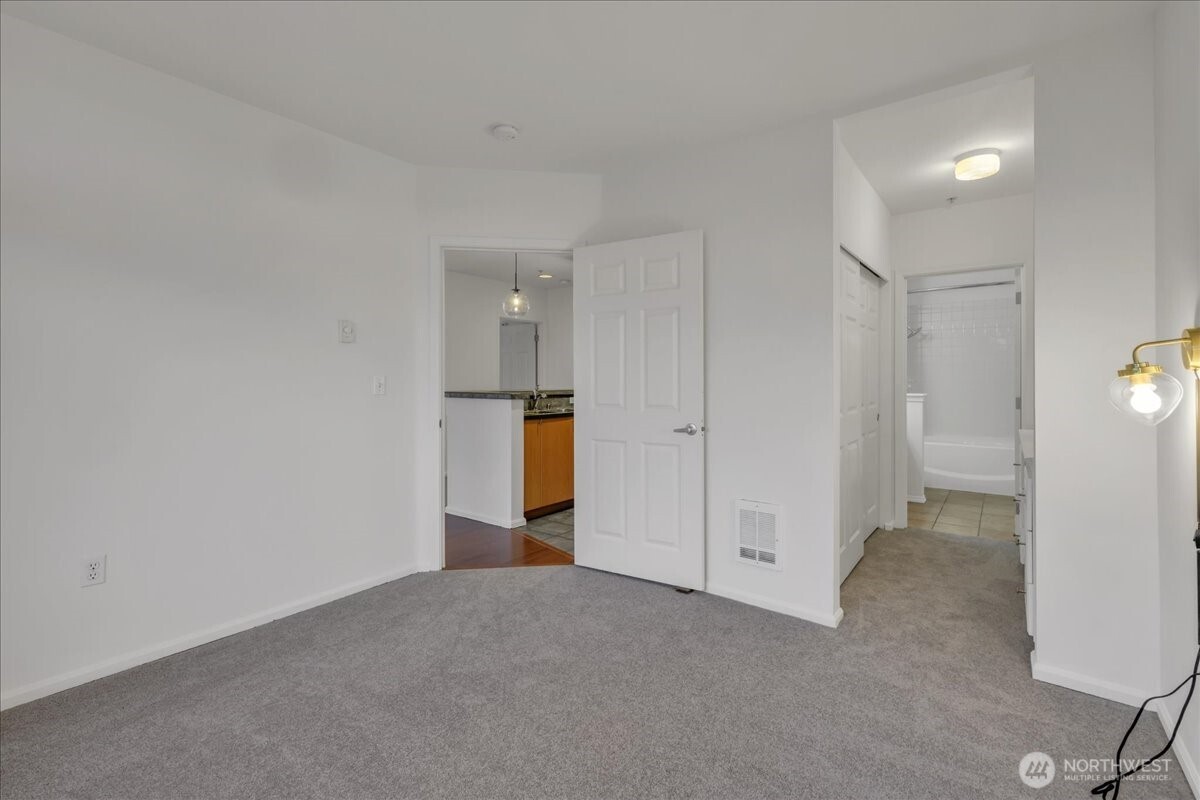 18 Dravus Street, Unit 207 Seattle, WA 98109 - Photo 18 of 34 a view of empty room with wooden floor