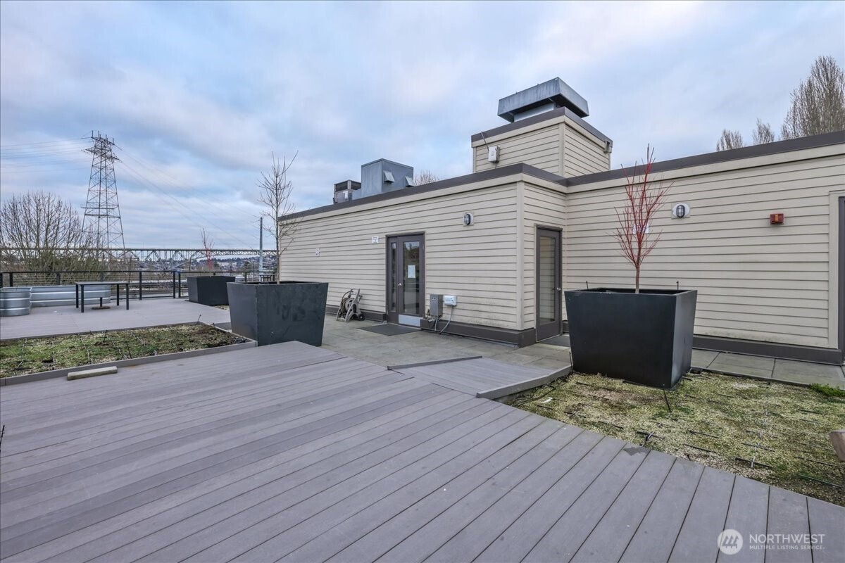 18 Dravus Street, Unit 207 Seattle, WA 98109 - Photo 30 of 34 a view of a terrace with wooden floor