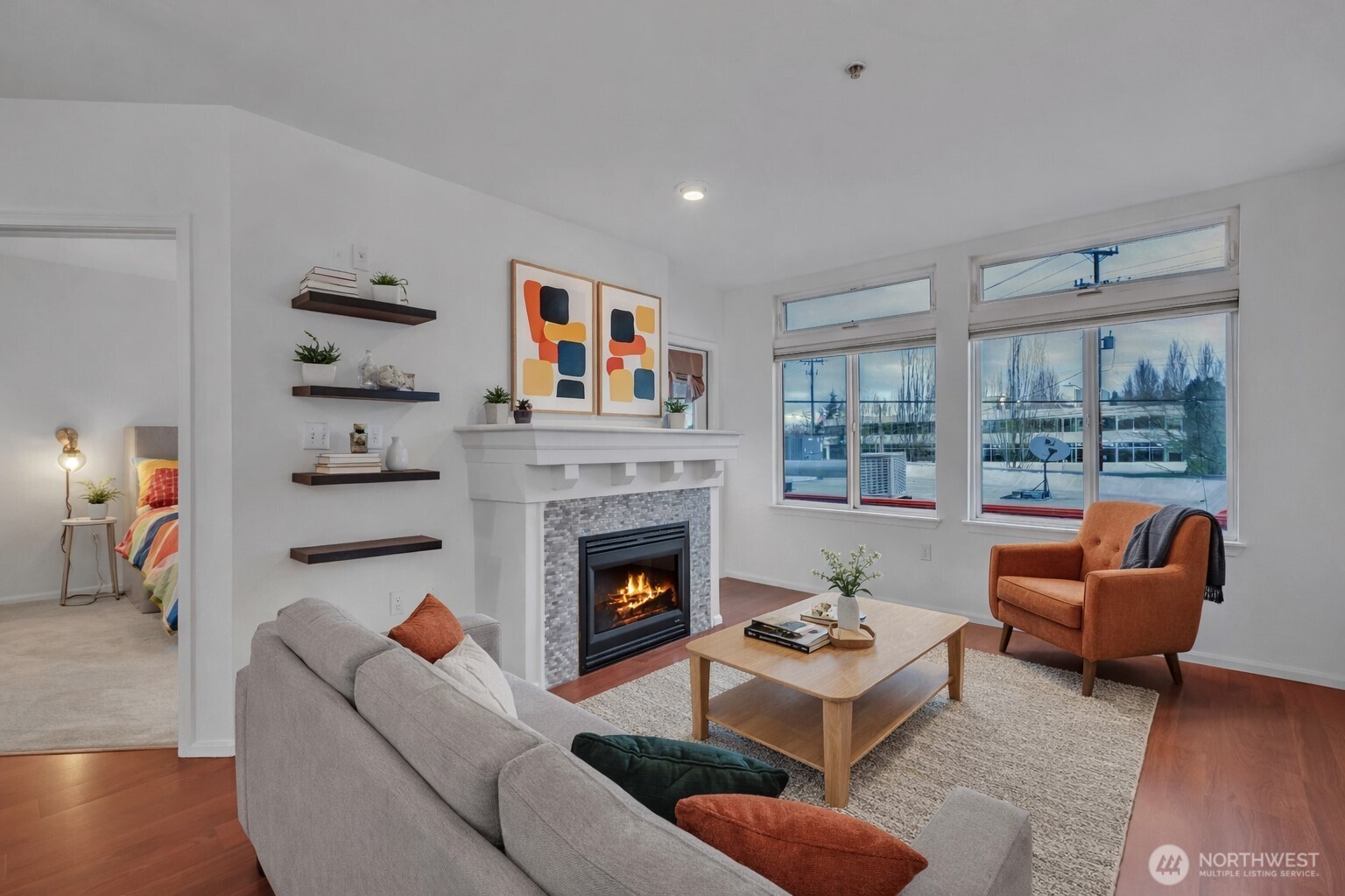 18 Dravus Street, Unit 207 Seattle, WA 98109 - Photo 9 of 34 a living room with furniture and a fireplace