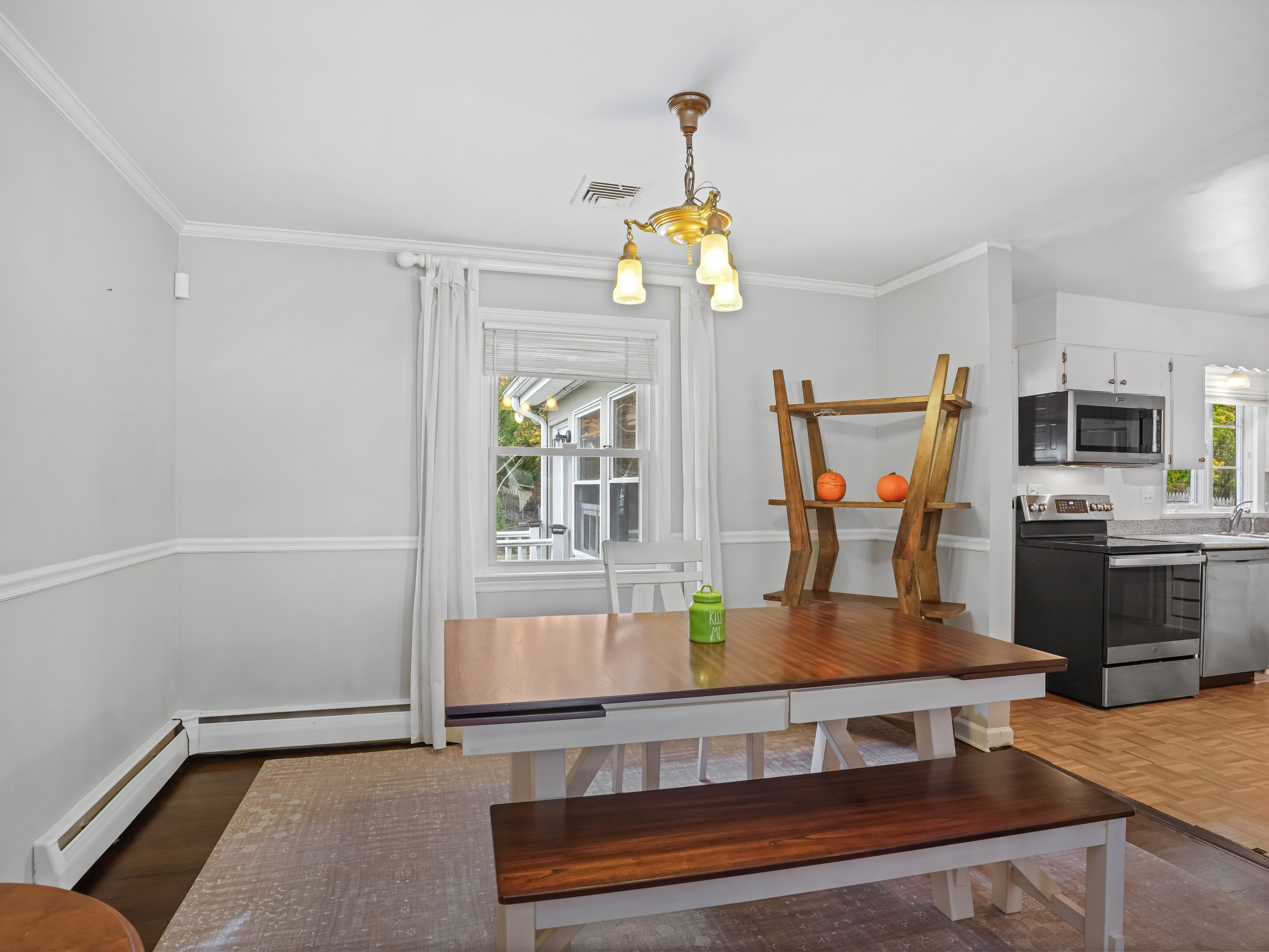 5 Maher Drive Norwalk, CT 06850 - Photo 12 of 36 a living room with stainless steel appliances furniture a chandelier and a table