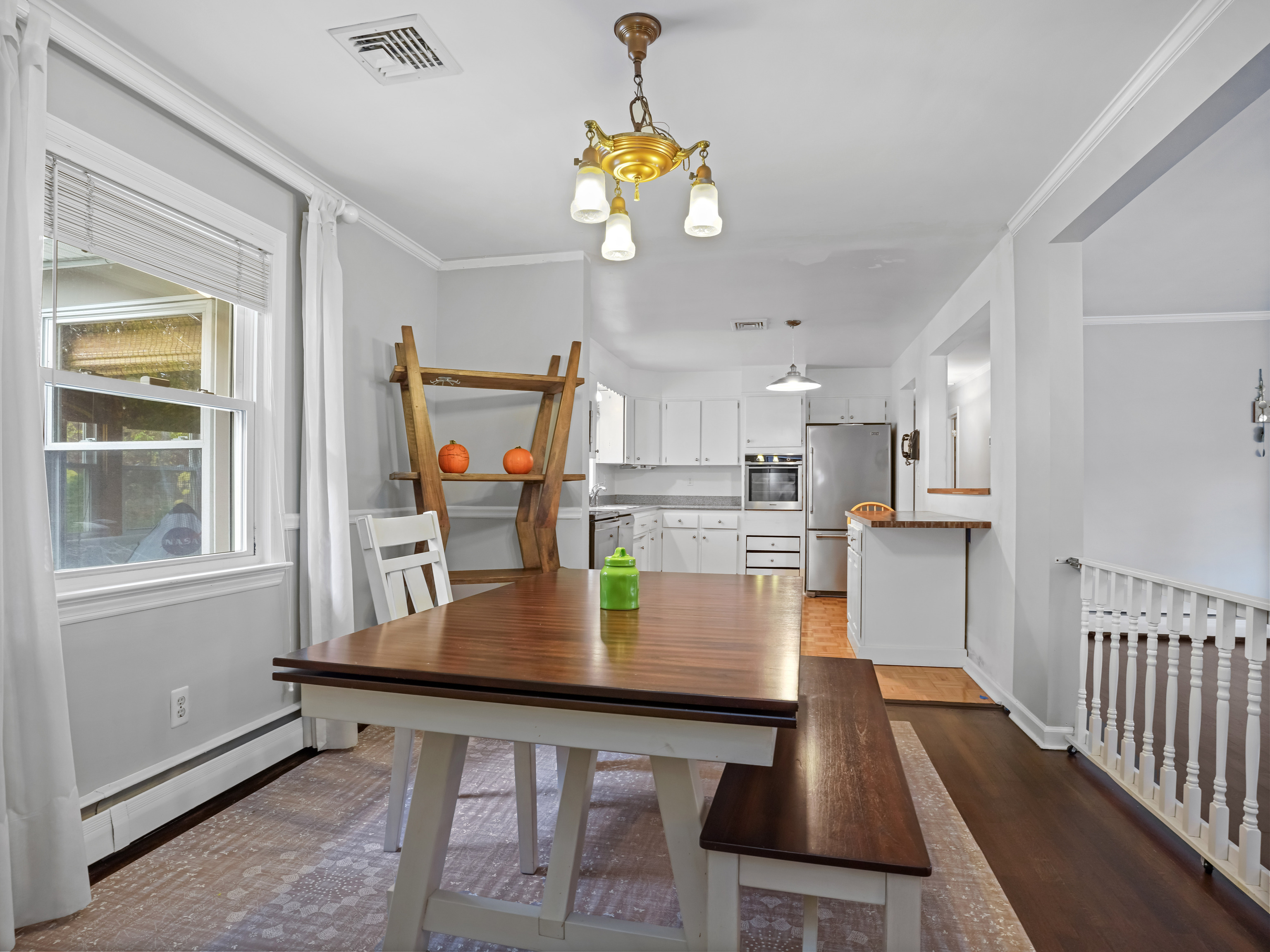 5 Maher Drive Norwalk, CT 06850 - Photo 13 of 36 a dining room with wooden floor and a chandelier