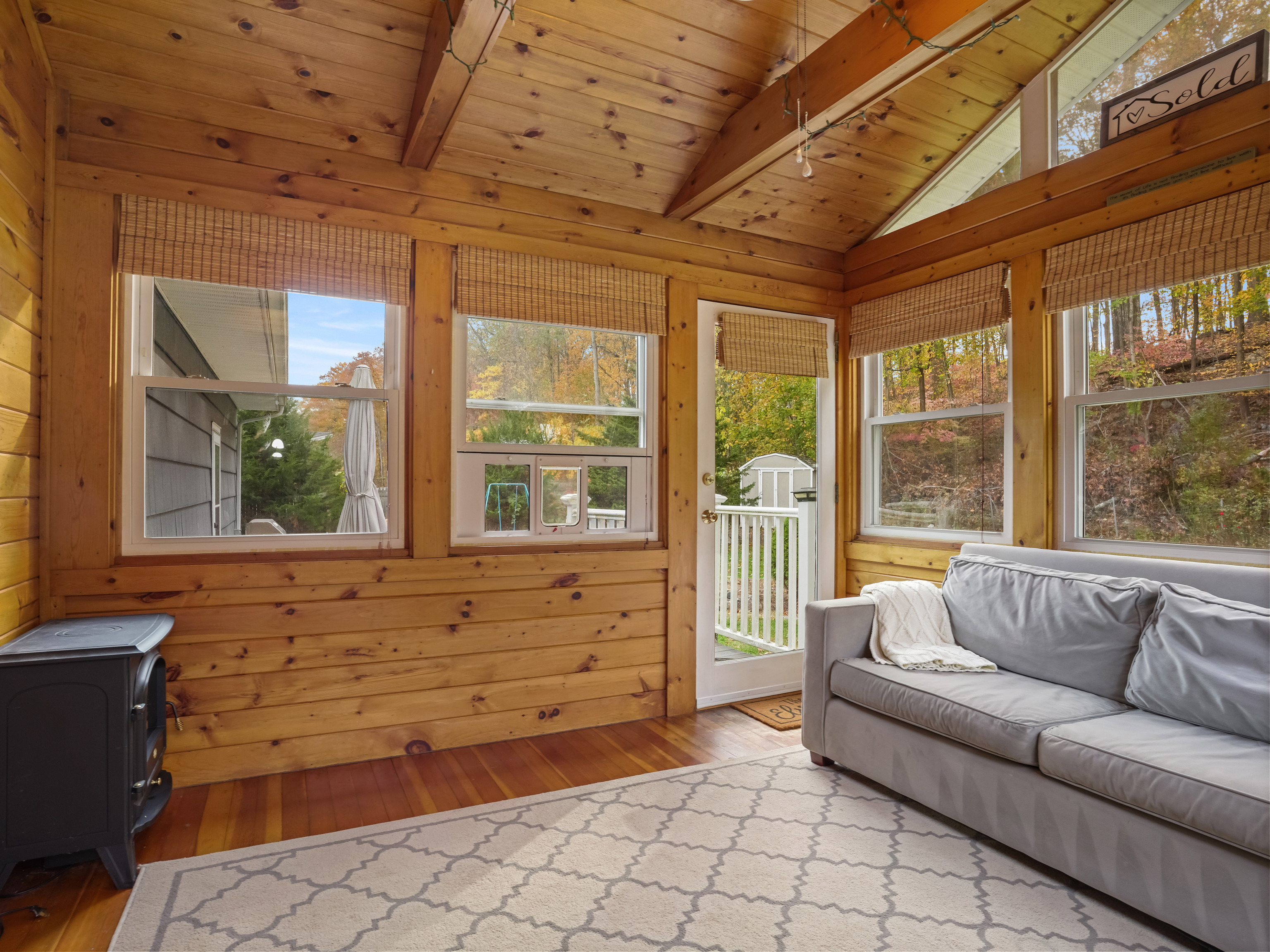 5 Maher Drive Norwalk, CT 06850 - Photo 16 of 36 a living room with furniture and large windows