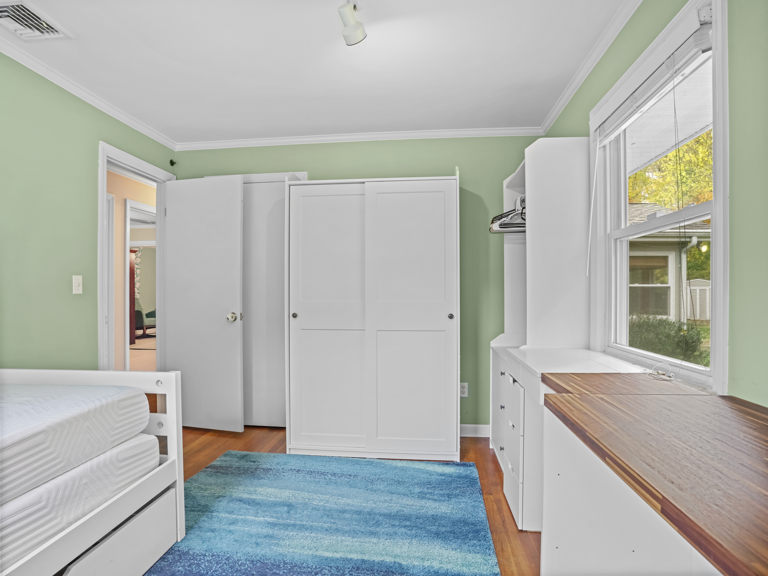 5 Maher Drive Norwalk, CT 06850 - Photo 25 of 36 a view of room with window and wooden floor