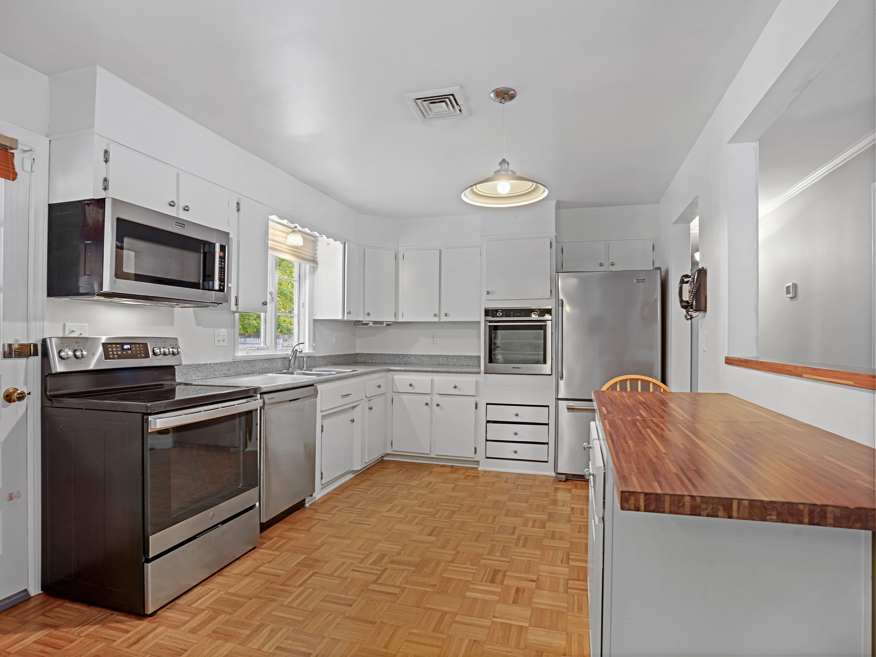 5 Maher Drive Norwalk, CT 06850 - Photo 8 of 36 a kitchen with stainless steel appliances granite countertop a refrigerator stove microwave and sink