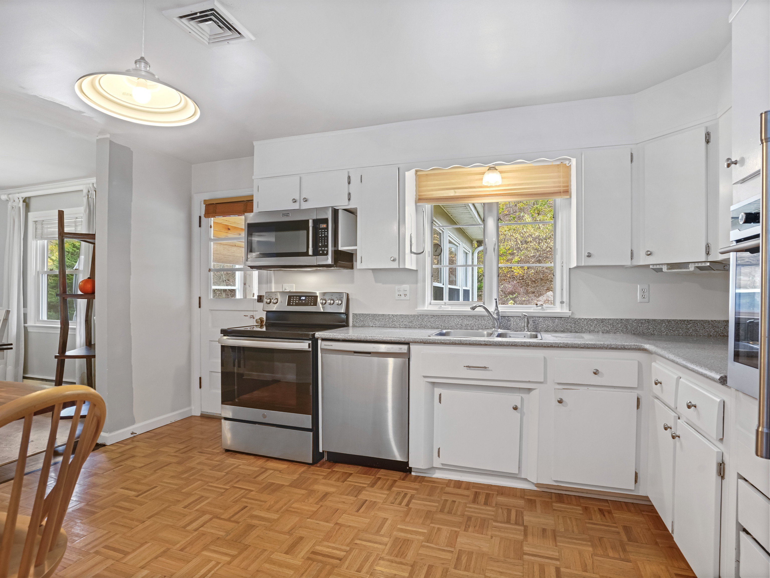 5 Maher Drive Norwalk, CT 06850 - Photo 9 of 36 a kitchen with granite countertop a sink stainless steel appliances and cabinets
