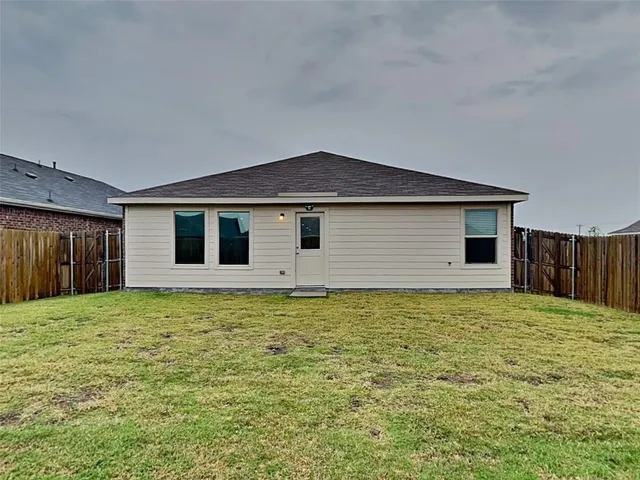 a house with yard in front of it