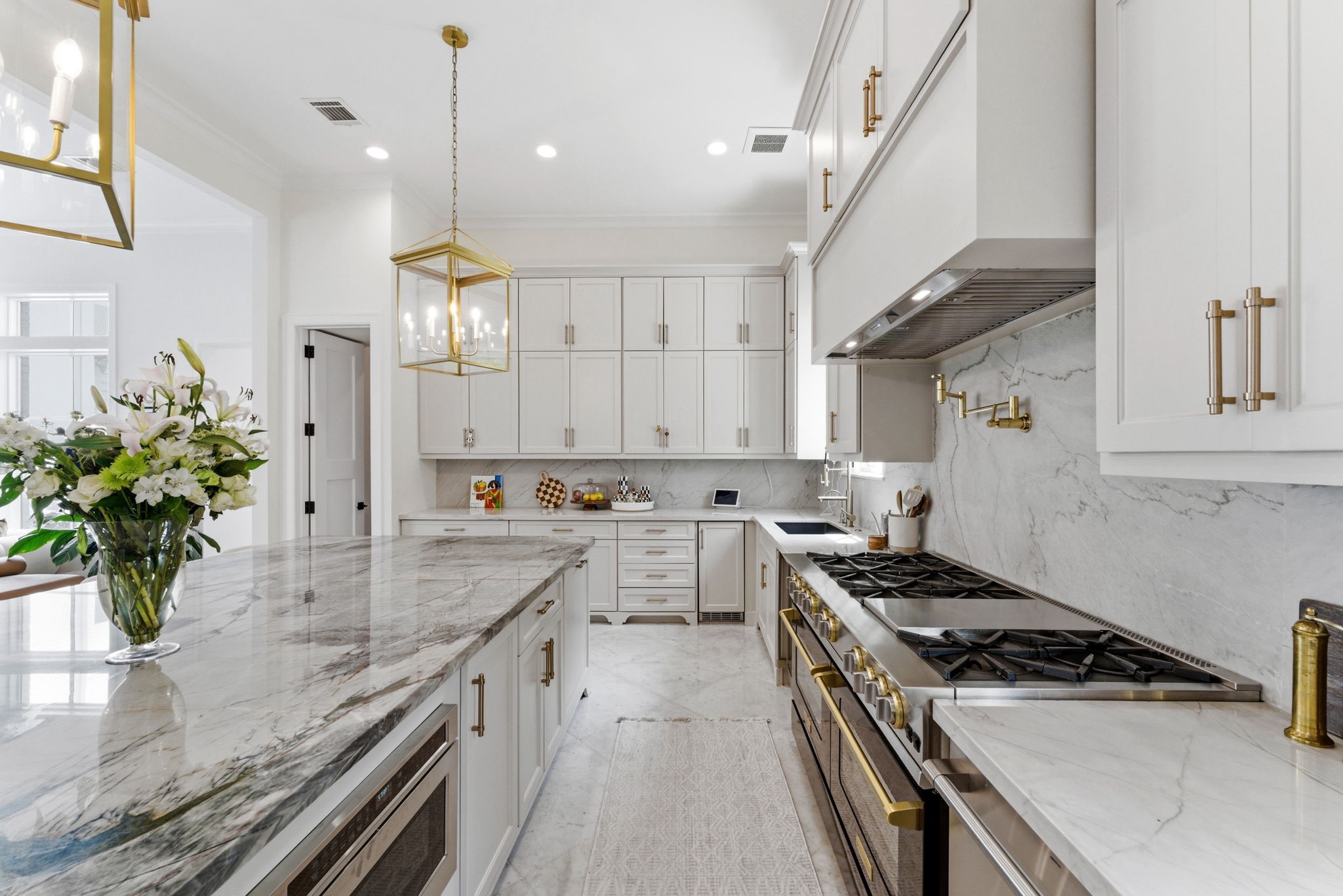 2211 Troon Road Houston, TX 77019 - Photo 13 of 44 a kitchen with stainless steel appliances granite countertop a sink stove and refrigerator