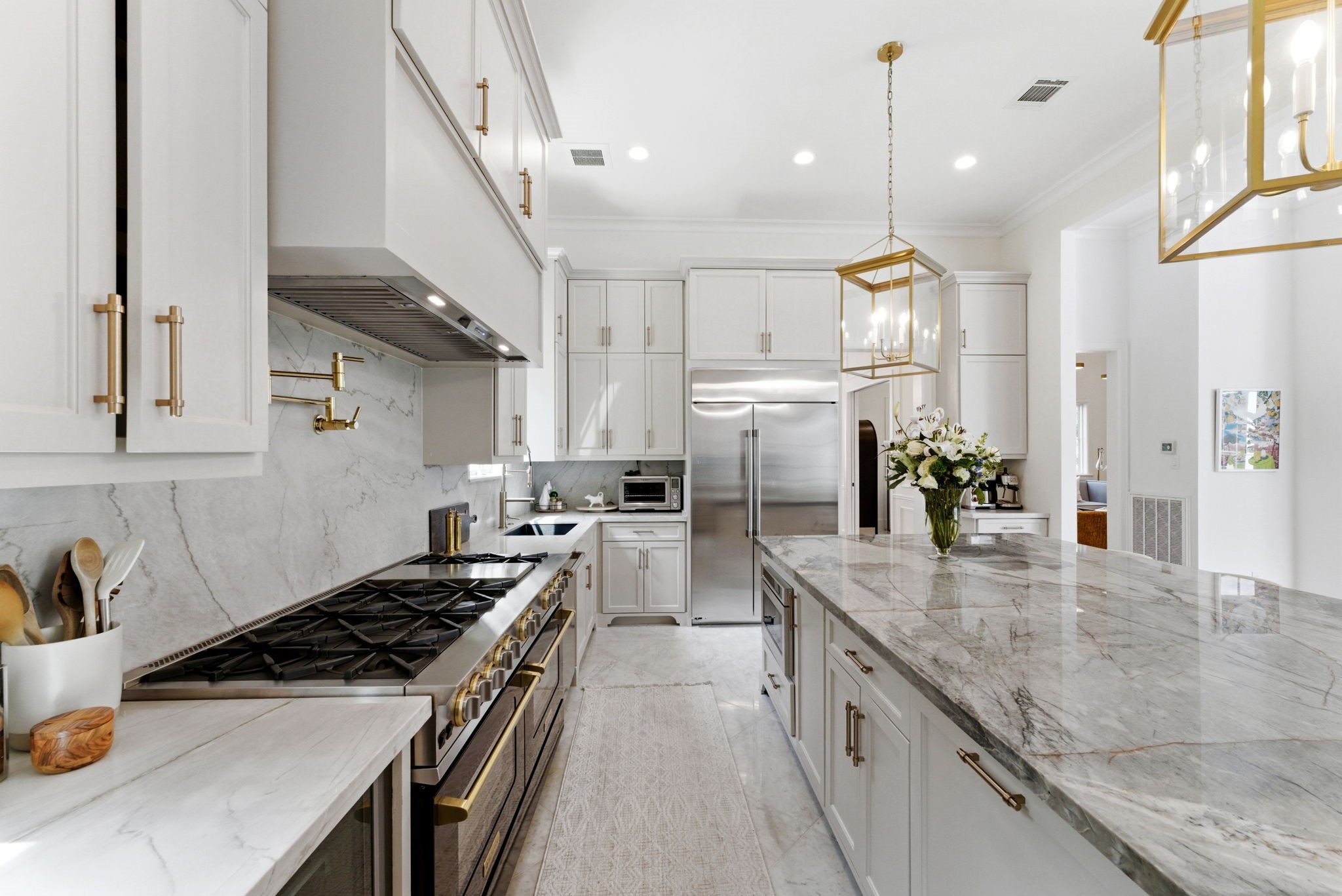 2211 Troon Road Houston, TX 77019 - Photo 14 of 44 a kitchen with refrigerator a stove and a sink