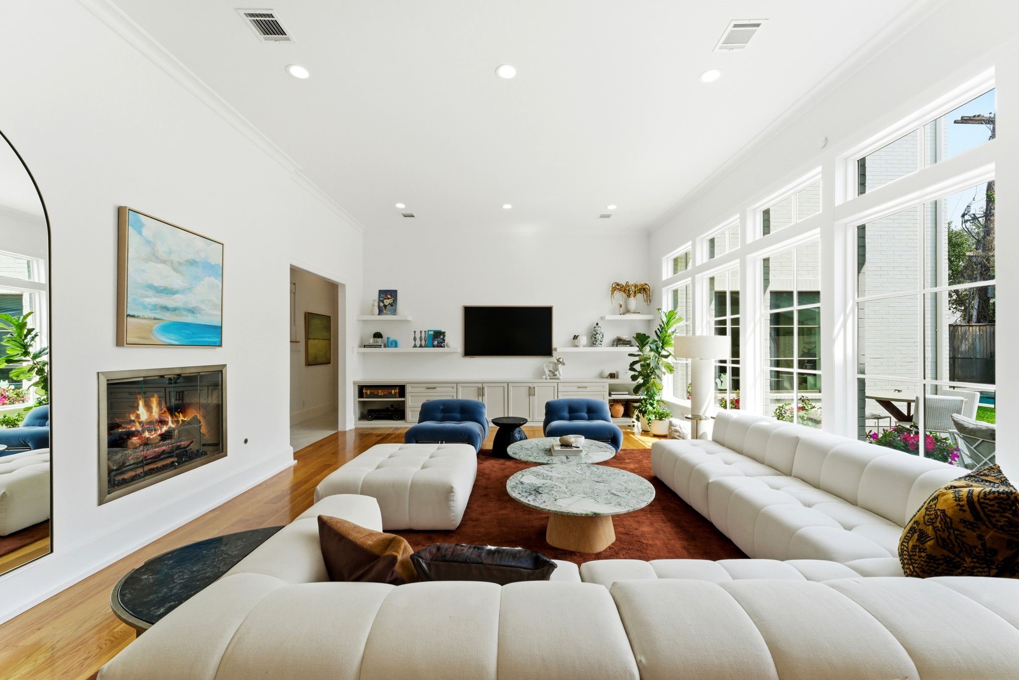 2211 Troon Road Houston, TX 77019 - Photo 15 of 44 a living room with furniture flat screen tv and a fireplace