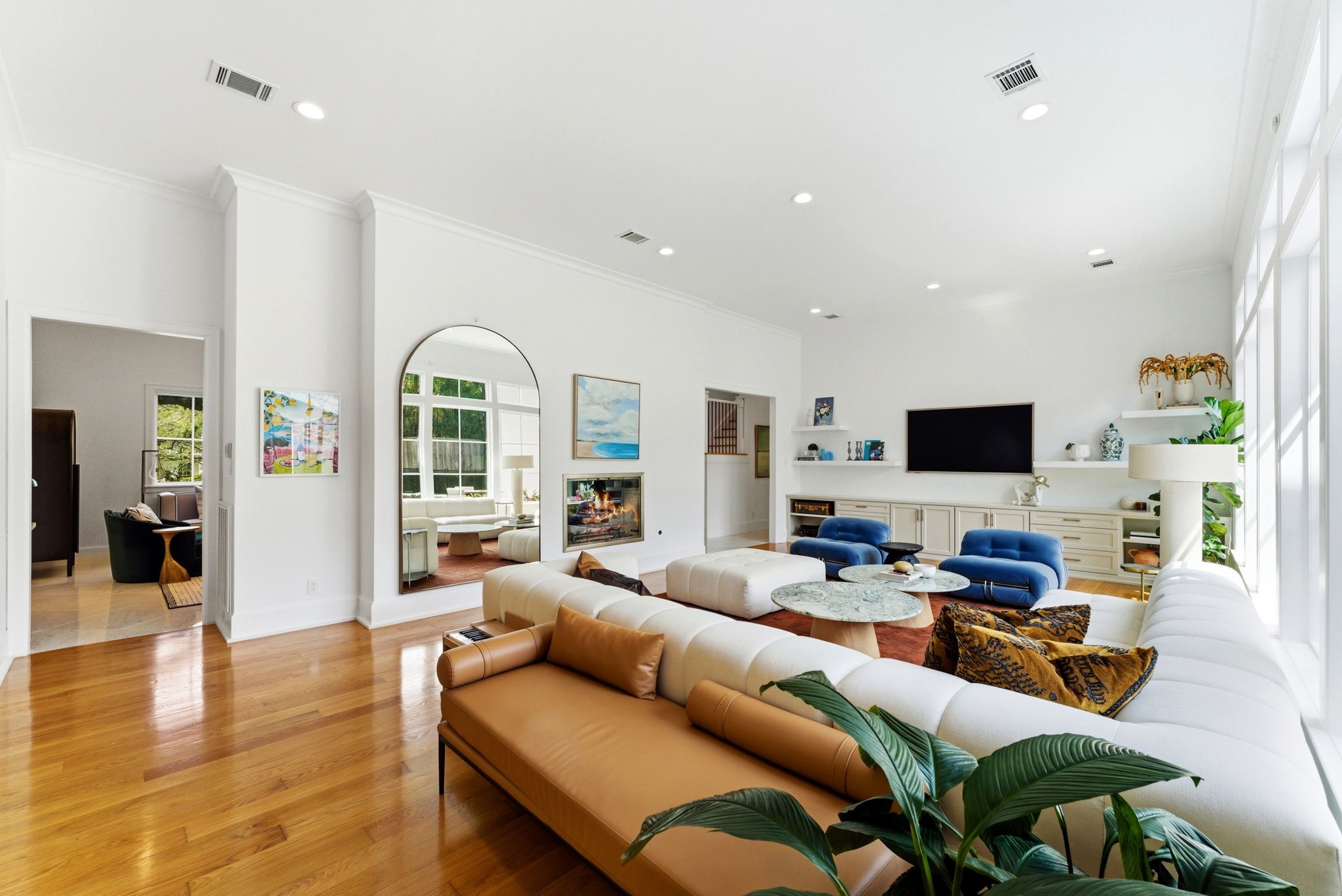 2211 Troon Road Houston, TX 77019 - Photo 16 of 44 a living room with furniture wooden floor and a flat screen tv