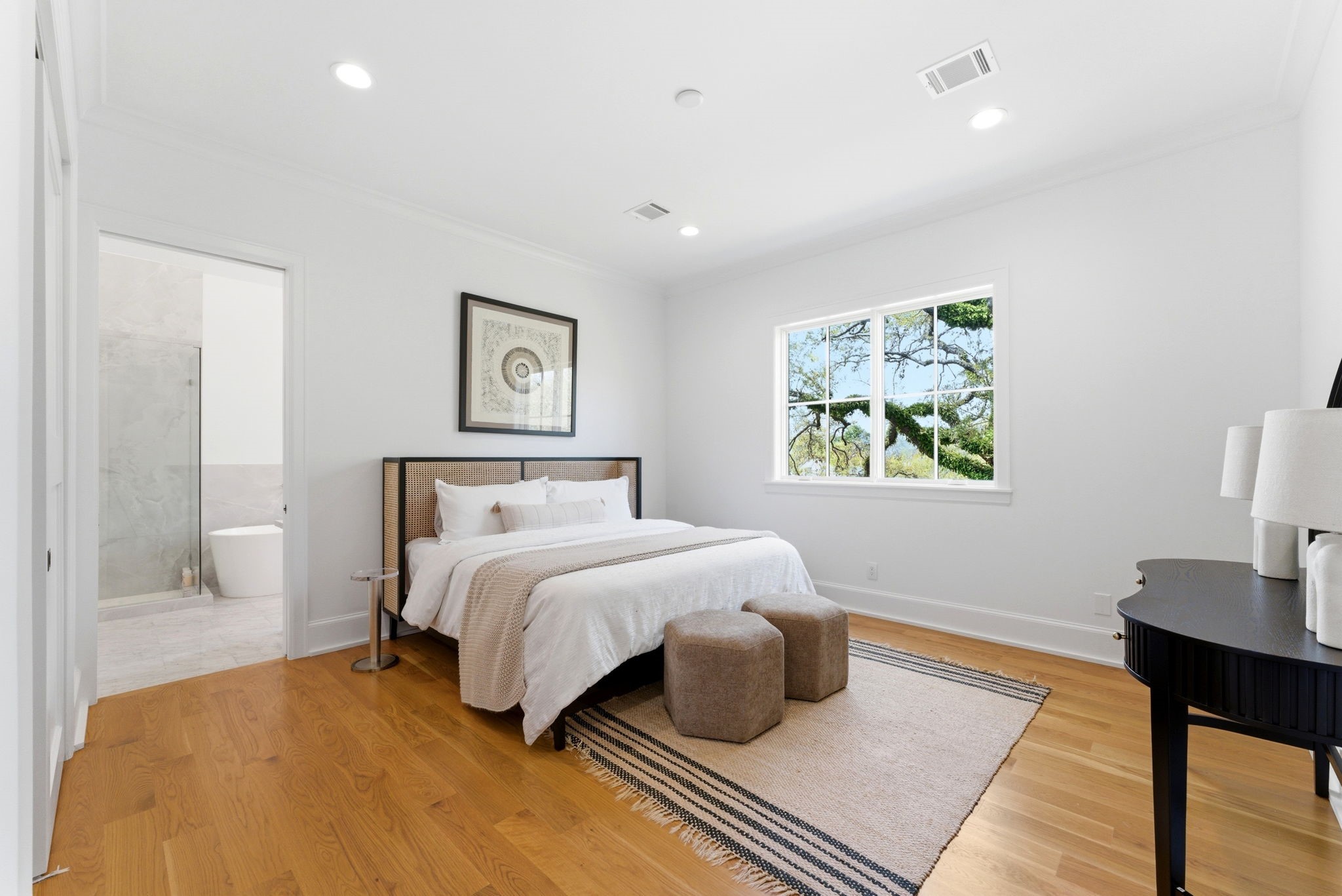 2211 Troon Road Houston, TX 77019 - Photo 23 of 44 a bedroom with a bed and wooden floor