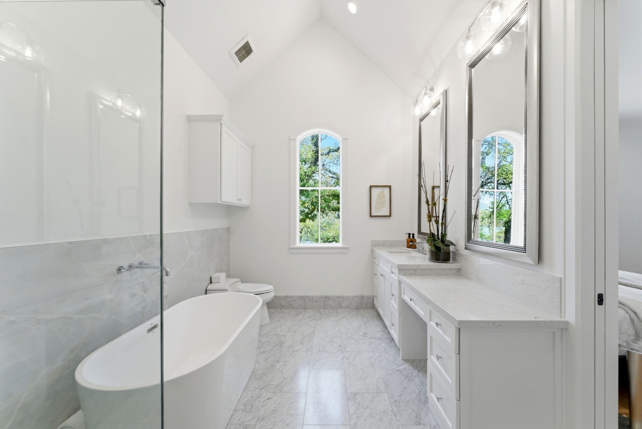 2211 Troon Road Houston, TX 77019 - Photo 24 of 44 a bathroom with a tub sink and window