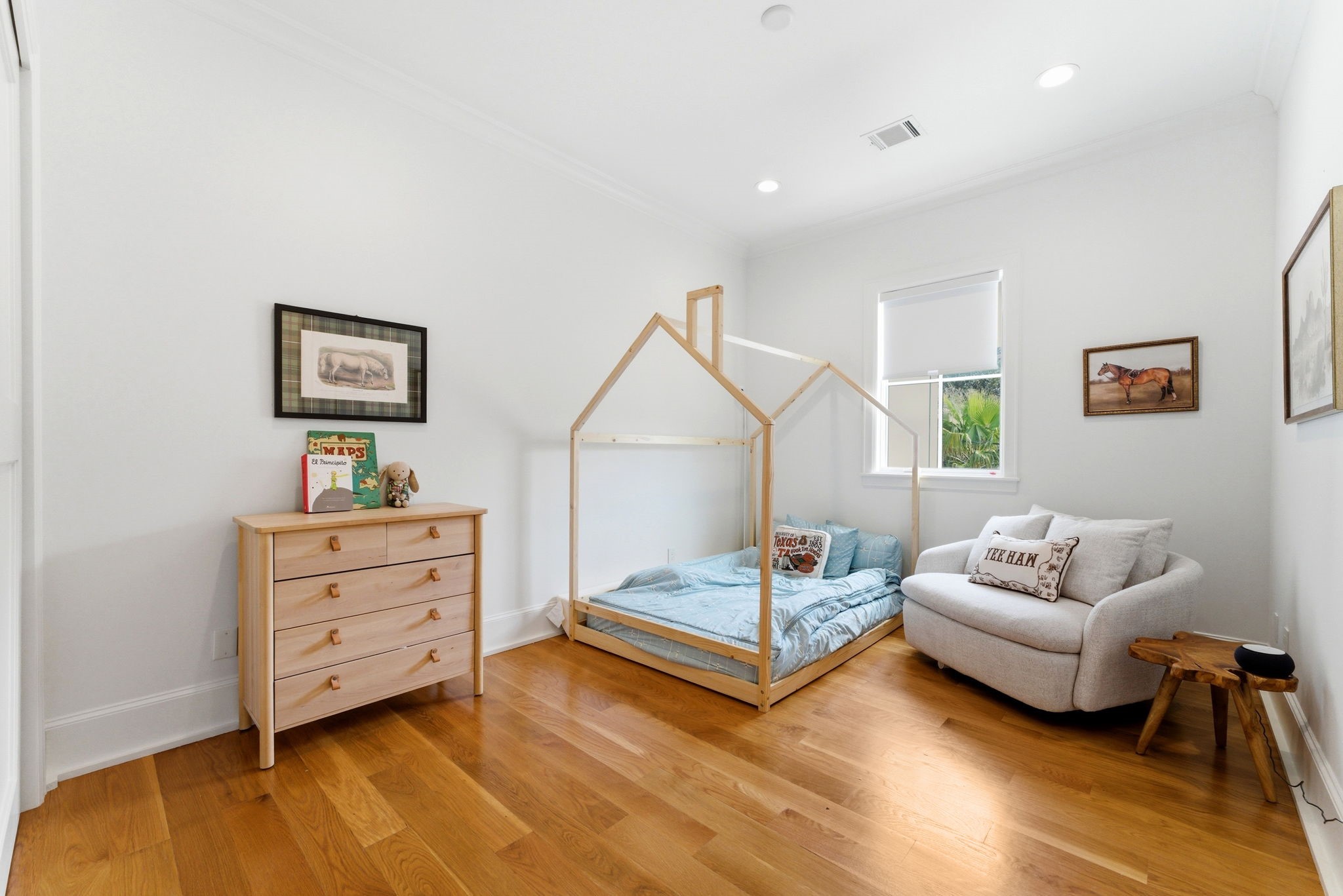 2211 Troon Road Houston, TX 77019 - Photo 26 of 44 a bedroom with a bed and a couch