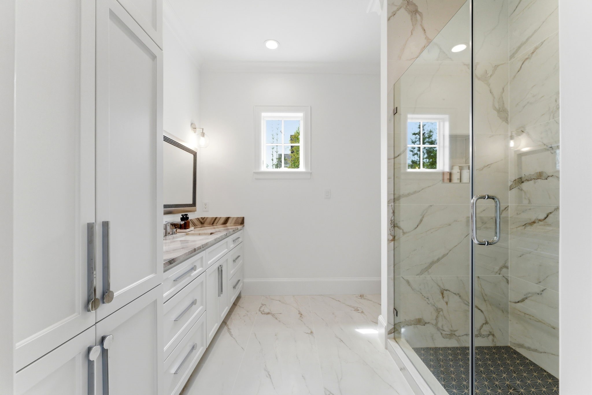 2211 Troon Road Houston, TX 77019 - Photo 29 of 44 a bathroom with a double vanity sink a toilet and shower
