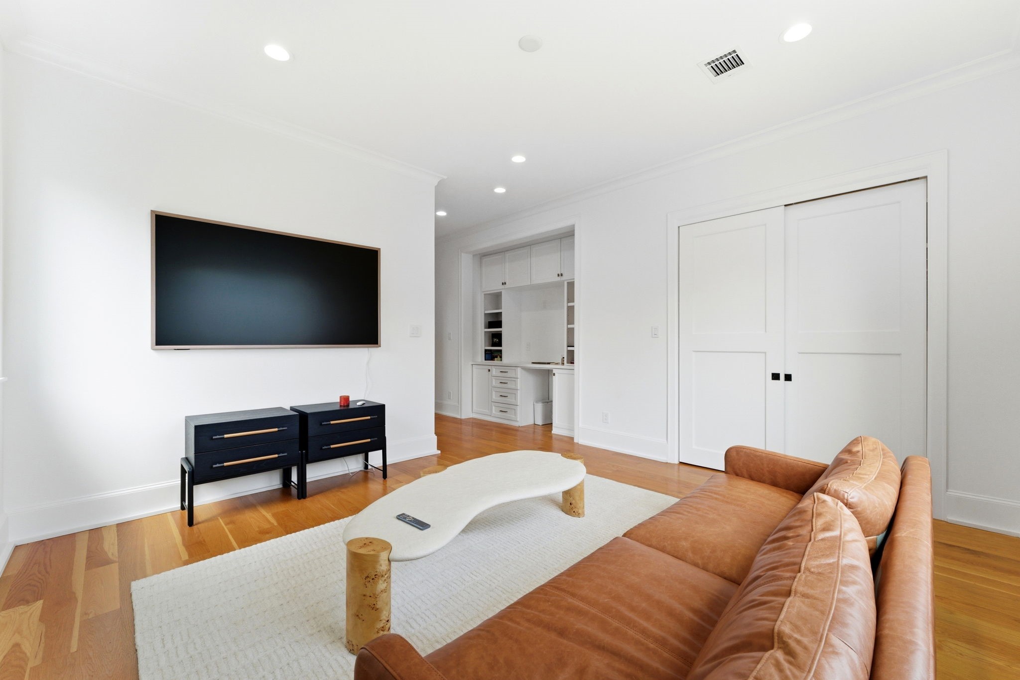 2211 Troon Road Houston, TX 77019 - Photo 30 of 44 a living room with furniture and a flat screen tv