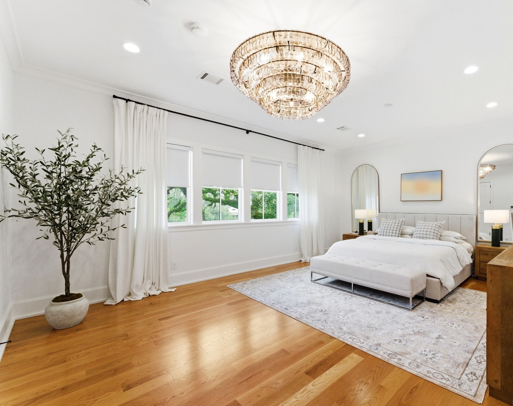 2211 Troon Road Houston, TX 77019 - Photo 31 of 44 a bedroom with a large bed and a chandelier