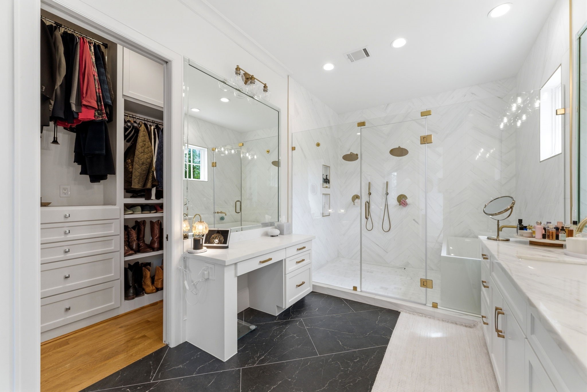2211 Troon Road Houston, TX 77019 - Photo 34 of 44 a bathroom with a double vanity sink a vanity and shower
