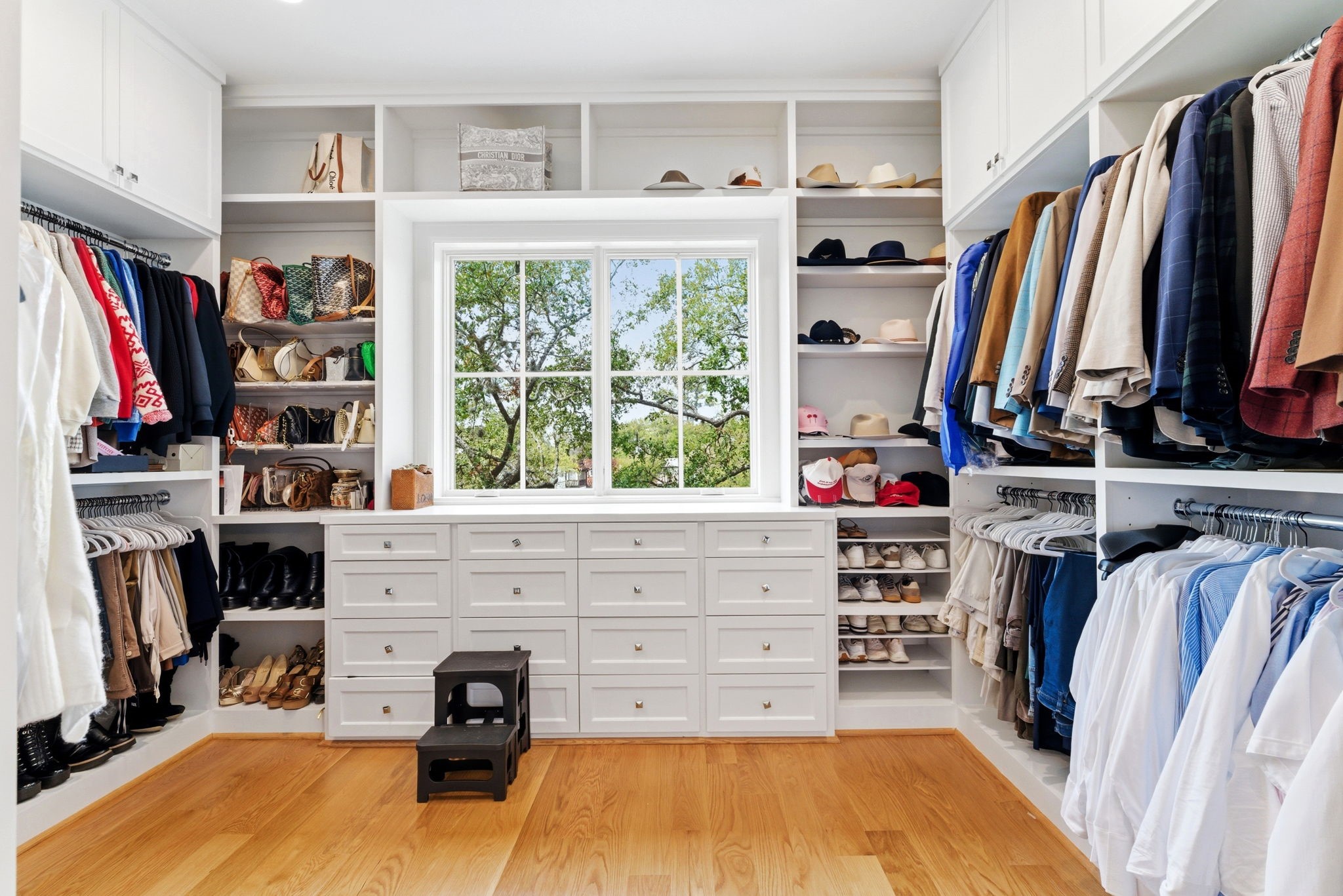 2211 Troon Road Houston, TX 77019 - Photo 36 of 44 a view of walk in closet with clothes and shoes