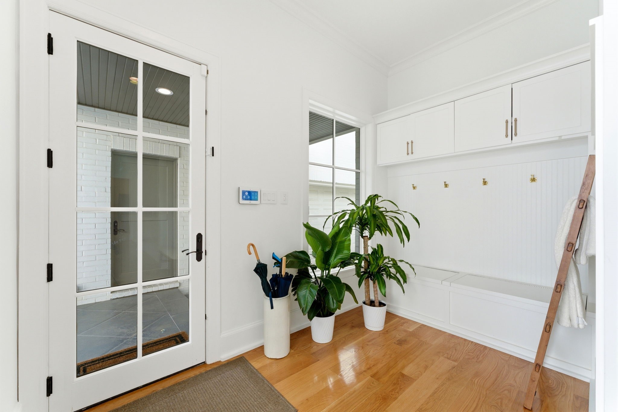 2211 Troon Road Houston, TX 77019 - Photo 37 of 44 a view of a potted plant in front of a cabinet