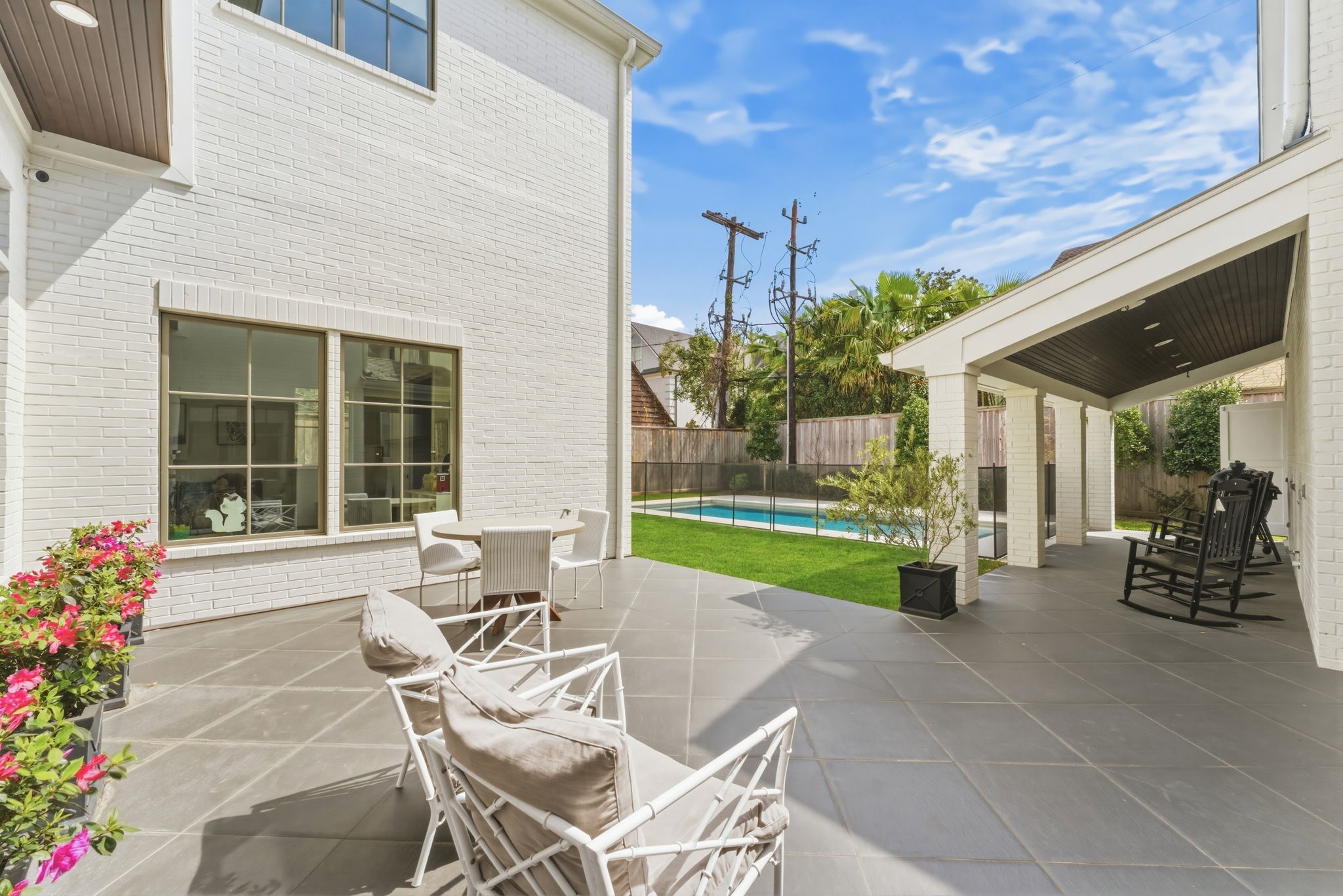 2211 Troon Road Houston, TX 77019 - Photo 38 of 44 a view of house with backyard and outdoor seating